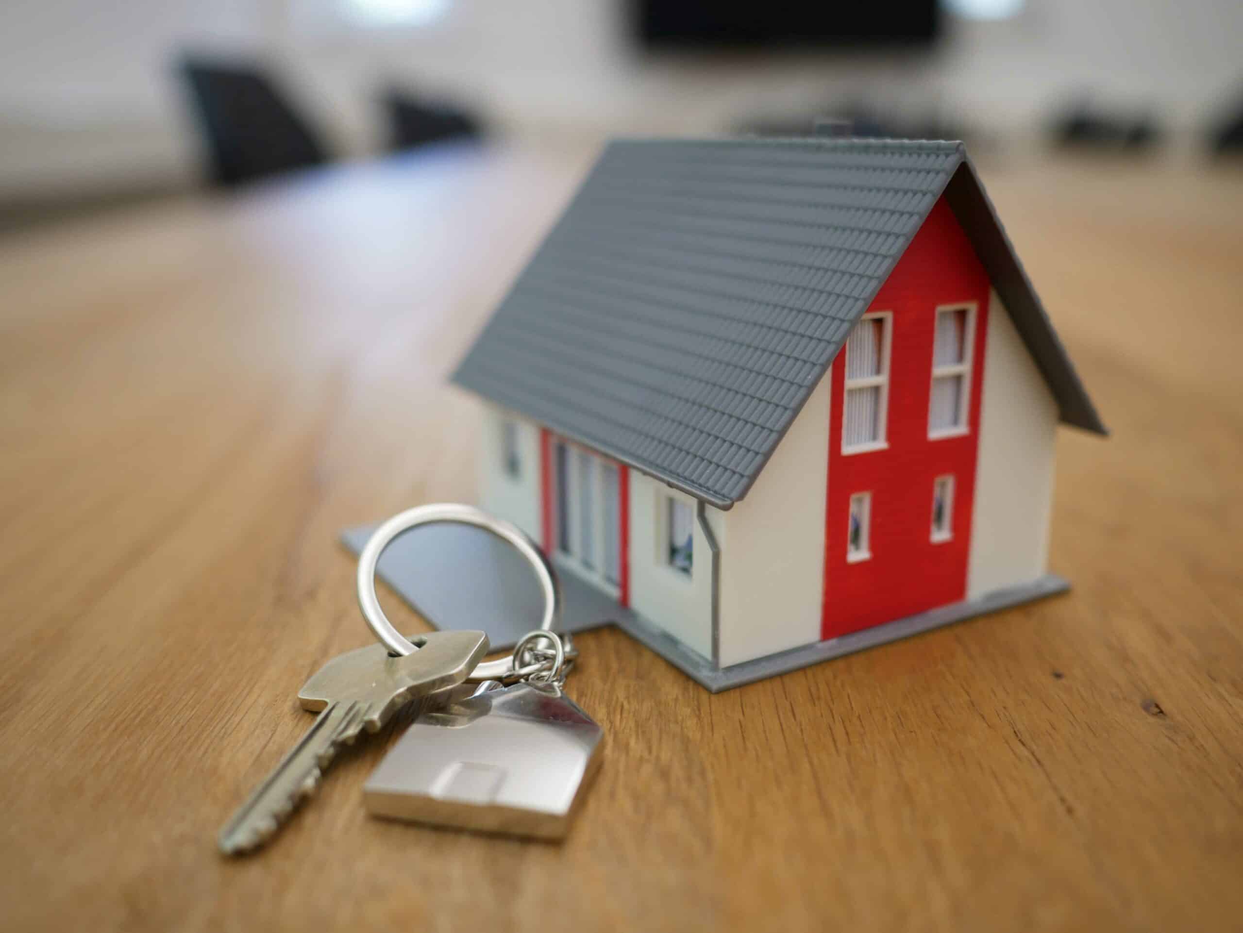 small house with a key next to it